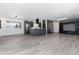 Open floor plan with gray cabinets, stainless appliances and gray flooring at 5886 S Logan St, Centennial, CO 80121