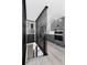 Contemporary staircase leading to a kitchen with gray cabinets and stainless steel appliances at 5886 S Logan St, Centennial, CO 80121