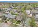 An aerial view of a residential area featuring a mix of homes, mature trees, and green spaces at 925 S University Blvd, Denver, CO 80209
