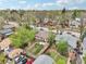 Aerial view highlighting the property's backyard, landscaping, and proximity to neighborhood amenities at 925 S University Blvd, Denver, CO 80209