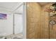 Bathroom shower shows tile and fixtures, with a partial view of toilet and an open doorway at 925 S University Blvd, Denver, CO 80209