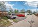 Driveway with parked cars and garages; providing ample parking and storage space at 925 S University Blvd, Denver, CO 80209
