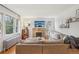 Inviting living room with a cozy fireplace, hardwood floors, and plenty of natural light at 925 S University Blvd, Denver, CO 80209