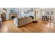 Open concept living room showcasing hardwood floors, fireplace, and seamless flow into the dining area at 925 S University Blvd, Denver, CO 80209