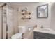 Clean bathroom with shower, toilet, and vanity at 7814 Club Crest Dr, Arvada, CO 80005