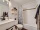 Clean bathroom with white subway tile and updated vanity at 7814 Club Crest Dr, Arvada, CO 80005