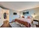 Main bedroom featuring a king-size bed and neutral color scheme at 7814 Club Crest Dr, Arvada, CO 80005