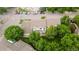 Aerial view of property showcasing mature trees, neighboring apartments and ample parking at 2143 Coronado N Pkwy # C, Denver, CO 80229
