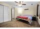 Carpeted bedroom with ceiling fan and closet at 2143 Coronado N Pkwy # C, Denver, CO 80229