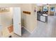 Hallway leading to a powder room and an open-concept kitchen and living area at 2143 Coronado N Pkwy # C, Denver, CO 80229