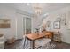 Dining room with stylish furnishings, contemporary lighting, and seamless access to the outdoor patio at 6027 N Netherland Ct, Aurora, CO 80019
