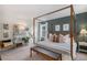 Stylishly decorated main bedroom with a four-poster bed, soft lighting, and ample space for relaxation at 6027 N Netherland Ct, Aurora, CO 80019
