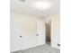 Finished basement featuring wainscoting, carpet, and two closets at 479 S Kendall St, Lakewood, CO 80226