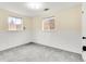 Finished basement featuring wainscoting, carpet, and two windows at 479 S Kendall St, Lakewood, CO 80226