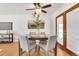 Inviting dining area with hardwood floors and a view to the backyard at 479 S Kendall St, Lakewood, CO 80226