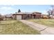 Single-Gathering home with a brick facade, attached garage, and a spacious front yard at 479 S Kendall St, Lakewood, CO 80226