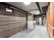 A laundry space featuring a washer, dryer, concrete walls, and concrete floors at 479 S Kendall St, Lakewood, CO 80226