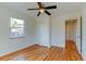 Cozy bedroom with ceiling fan, hardwood floors, and closet space at 4078 Ames St, Wheat Ridge, CO 80212