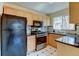 View of the Kitchen featuring stainless steel appliances and maple cabinets at 4078 Ames St, Wheat Ridge, CO 80212