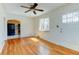 Inviting living room featuring hardwood floors, a ceiling fan, and an abundance of natural light at 4078 Ames St, Wheat Ridge, CO 80212