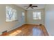 Living room featuring hardwood floors, neutral paint, and large windows providing natural light at 4078 Ames St, Wheat Ridge, CO 80212