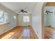 This bright living room features hardwood floors, and large windows that let in natural light at 4078 Ames St, Wheat Ridge, CO 80212