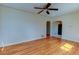 Living room featuring hardwood floors, neutral paint, and an open doorway to the kitchen at 4078 Ames St, Wheat Ridge, CO 80212