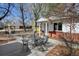 Outdoor patio featuring a table with chairs, complemented by mature trees and a cozy ambiance at 4078 Ames St, Wheat Ridge, CO 80212