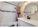 Stylish bathroom features a shower over bath, modern fixtures, and sleek vanity with ample storage at 6333 Zang Ct # E, Arvada, CO 80004