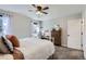 Bright bedroom features carpet floors, neutral walls, and closet at 6333 Zang Ct # E, Arvada, CO 80004