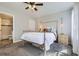 Cozy bedroom with soft lighting, a comfortable bed, and a neutral color scheme for relaxation at 6333 Zang Ct # E, Arvada, CO 80004