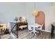 Inviting dining area features laminate floors, stylish lighting, and modern décor at 6333 Zang Ct # E, Arvada, CO 80004