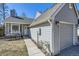 Charming home featuring a well-maintained yard and a welcoming front entrance with comfortable outdoor seating at 6333 Zang Ct # E, Arvada, CO 80004