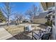 Inviting front yard with outdoor seating, gravel accents, and a view of the neighborhood at 6333 Zang Ct # E, Arvada, CO 80004