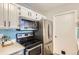 Efficient kitchen layout featuring updated appliances, ample counter space, and a clean, modern design at 6333 Zang Ct # E, Arvada, CO 80004