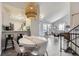 Open floor plan with dining area and kitchen featuring modern light fixtures and seamless flow at 6333 Zang Ct # E, Arvada, CO 80004