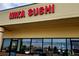 Mika Sushi storefront with clear signage, inviting open Sapporo signage, and large windows at 6333 Zang Ct # E, Arvada, CO 80004