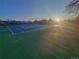 Community tennis court featuring well-maintained green and blue surface, ready for a match at 6333 Zang Ct # E, Arvada, CO 80004