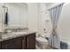 This well-lit bathroom features a shower and granite countertop for a clean, modern feel at 154 Back Nine Dr, Castle Pines, CO 80108