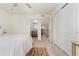 Serene bedroom with bright light near the ensuite bathroom entry and built in wardrobe storage for comfort and privacy at 154 Back Nine Dr, Castle Pines, CO 80108