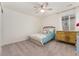 Cozy bedroom with a ceiling fan, plush carpeting, a window with blinds, and a decorative chest at 154 Back Nine Dr, Castle Pines, CO 80108