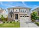 Charming two-story home with a stone-accented entrance, neutral siding, and a well-manicured front yard at 154 Back Nine Dr, Castle Pines, CO 80108