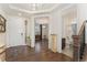 Inviting foyer with hardwood floors showcases views of a bathroom and front room, creating an open flow at 154 Back Nine Dr, Castle Pines, CO 80108