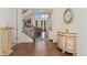 The welcoming foyer showcases hardwood floors, a staircase, and decor that creates a warm and inviting atmosphere at 154 Back Nine Dr, Castle Pines, CO 80108