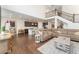 Open-concept living area showcasing seamless transition to kitchen and stairs to the second floor at 154 Back Nine Dr, Castle Pines, CO 80108