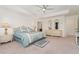 Cozy main bedroom with tray ceiling, accent lamps, and decorative details creates a peaceful retreat at 154 Back Nine Dr, Castle Pines, CO 80108