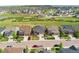 Street view of three attractive homes, highlighting their exteriors, landscaping, and curb appeal at 154 Back Nine Dr, Castle Pines, CO 80108