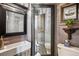 Stylish bathroom featuring a modern sink, decorative mirror and artwork, plus toilet, blending rustic & modern at 1744 Brookside Dr, Highlands Ranch, CO 80126