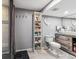 Clean bathroom features a shower, toilet, vanity with sink, and practical shelving at 1744 Brookside Dr, Highlands Ranch, CO 80126