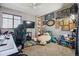 Unique bedroom with gaming setup, plush toys, TV and large window, perfect for relaxation at 1744 Brookside Dr, Highlands Ranch, CO 80126